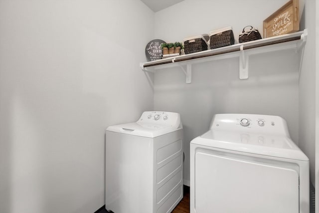 laundry room with laundry area and washing machine and clothes dryer