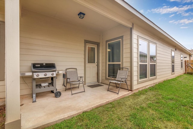 view of patio / terrace with area for grilling and fence