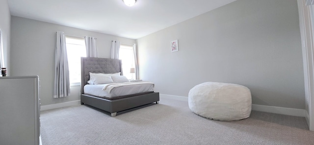 carpeted bedroom with baseboards