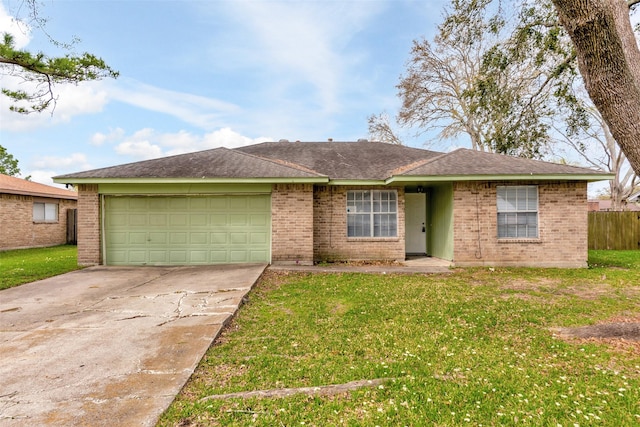 single story home with brick siding, driveway, a front yard, and a garage