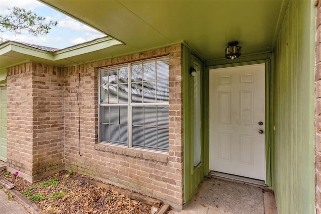 property entrance with brick siding