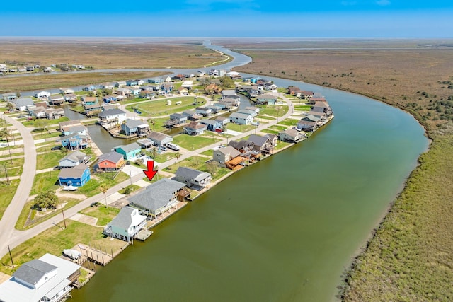 birds eye view of property featuring a residential view and a water view