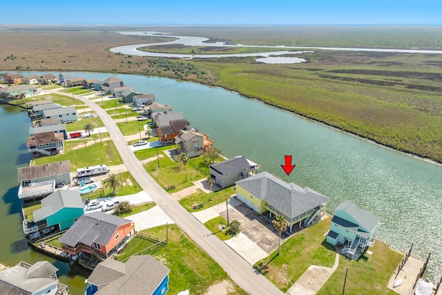 birds eye view of property featuring a residential view and a water view