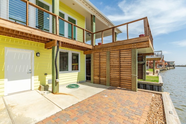 view of patio with a water view