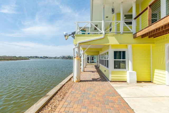 doorway to property with a water view