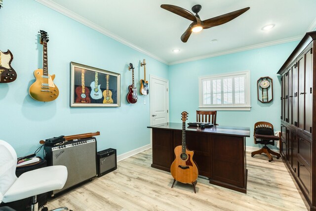 home office featuring a ceiling fan, baseboards, light wood finished floors, and ornamental molding