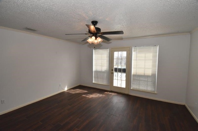 spare room featuring visible vents, baseboards, a textured ceiling, a ceiling fan, and wood-type flooring