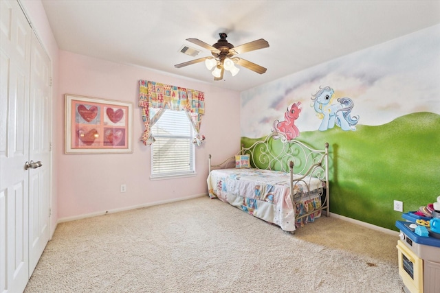 bedroom featuring carpet flooring, baseboards, visible vents, and ceiling fan