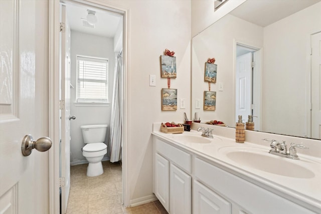 full bathroom with double vanity, toilet, visible vents, and a sink