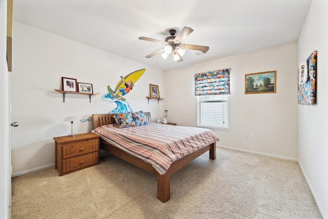 bedroom featuring light carpet, ceiling fan, and baseboards