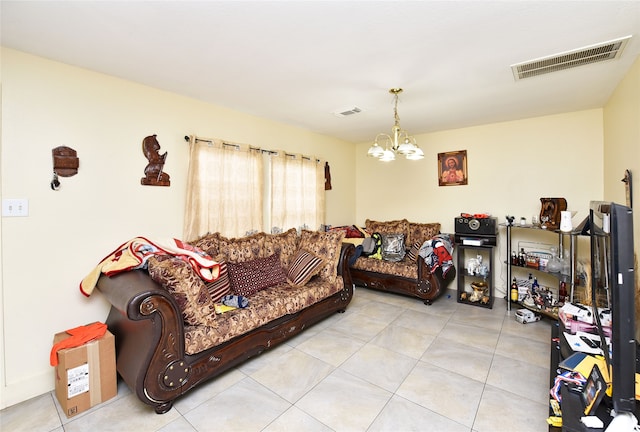 living room with tile patterned floors, a notable chandelier, and visible vents