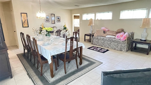 dining space with visible vents and light tile patterned flooring