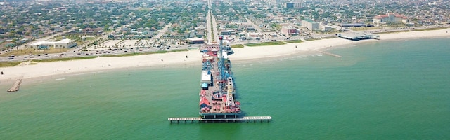 bird's eye view featuring a view of the beach and a water view