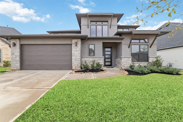 prairie-style home featuring a front yard, stucco siding, driveway, stone siding, and an attached garage