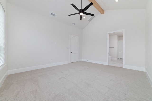 spare room with visible vents, baseboards, ceiling fan, beam ceiling, and carpet flooring