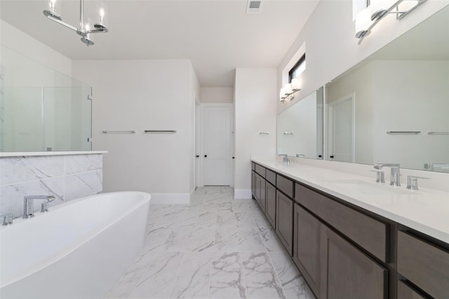 bathroom featuring visible vents, a soaking tub, double vanity, a sink, and marble finish floor