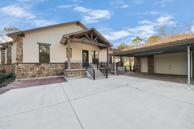 view of front of property with stone siding and metal roof