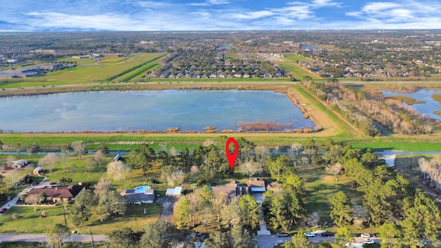 drone / aerial view featuring a rural view and a water view