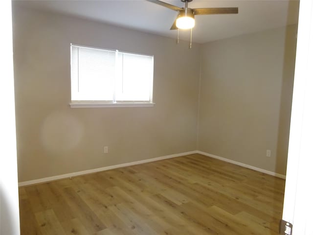 unfurnished room with a ceiling fan, baseboards, and light wood finished floors