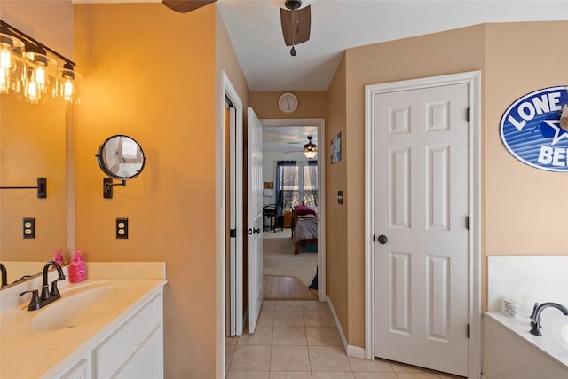 full bath featuring connected bathroom, ceiling fan, a garden tub, tile patterned floors, and vanity