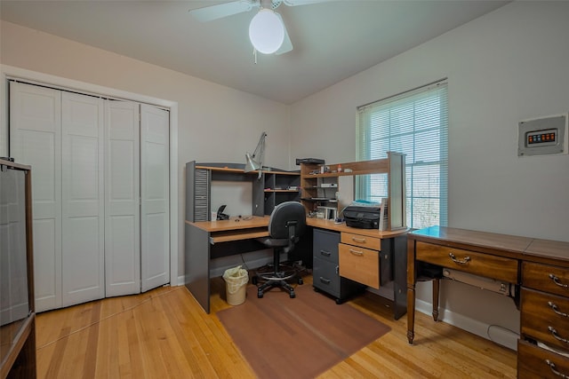 office area with light wood finished floors and a ceiling fan