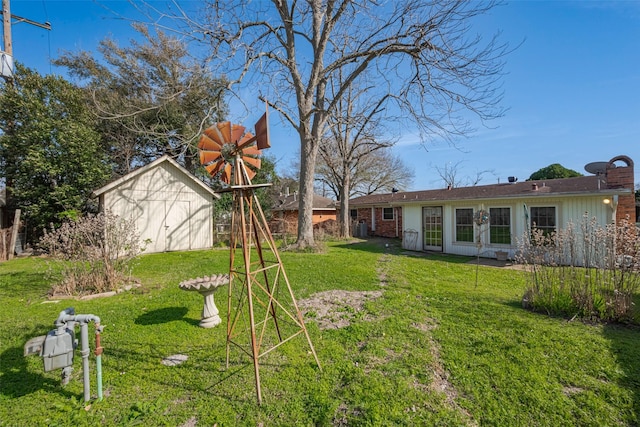 view of yard with an outbuilding