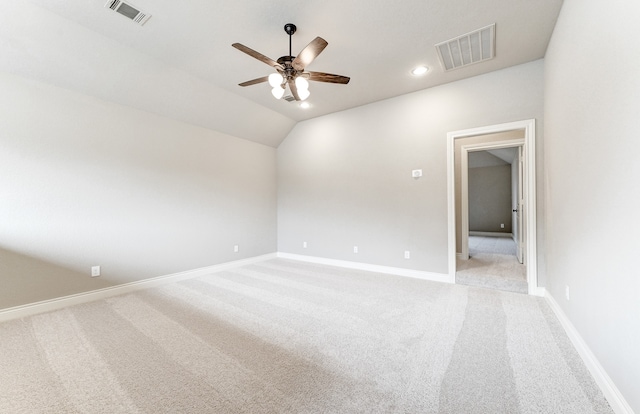 empty room featuring light carpet, visible vents, a ceiling fan, and baseboards