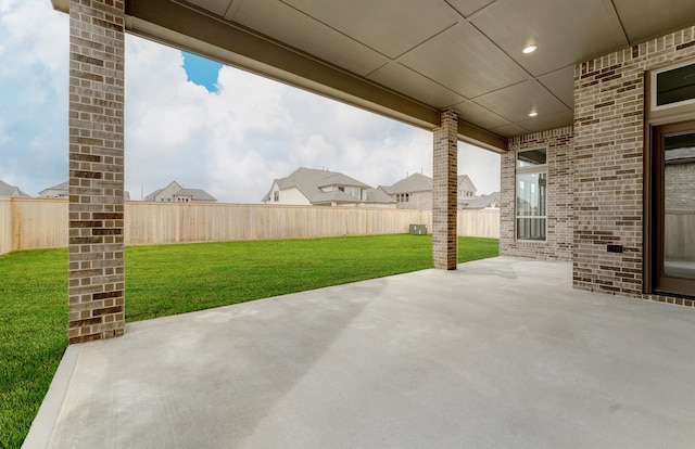 view of patio / terrace featuring fence