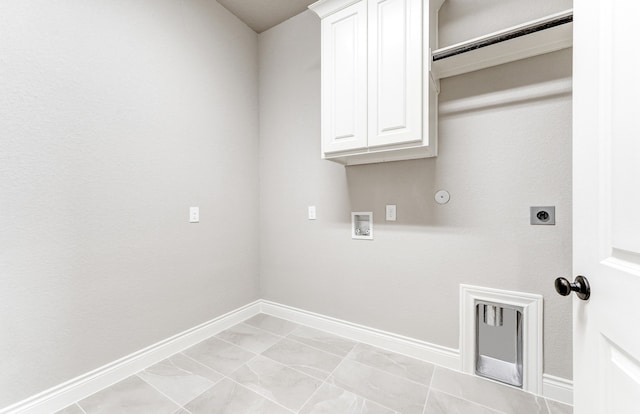 laundry room with hookup for a washing machine, baseboards, cabinet space, electric dryer hookup, and hookup for a gas dryer