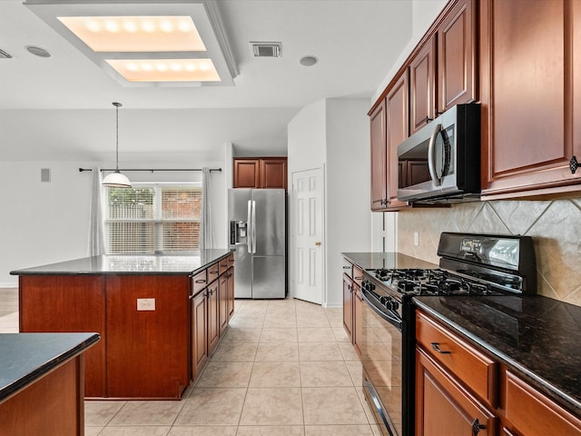 kitchen featuring decorative backsplash, light tile patterned floors, visible vents, and appliances with stainless steel finishes