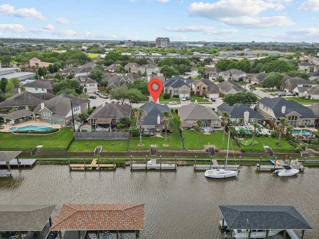 bird's eye view with a residential view and a water view