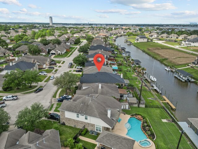 birds eye view of property featuring a residential view and a water view