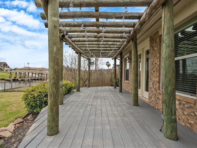 wooden deck with fence and a pergola