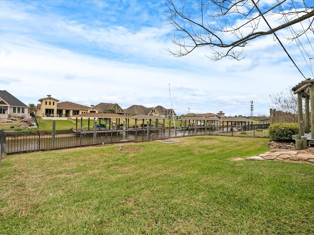 view of yard with fence and a residential view