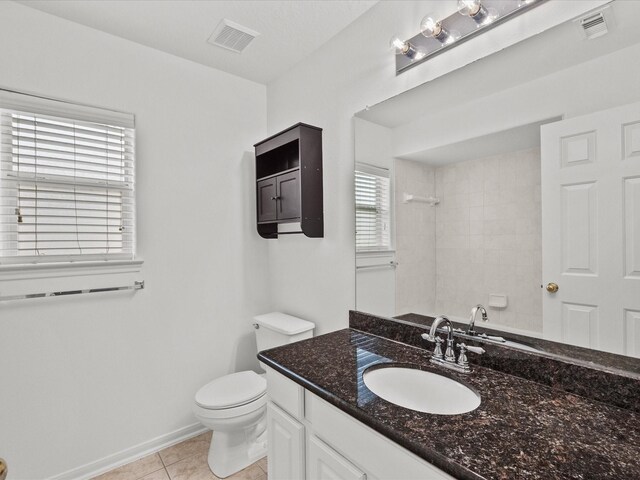 full bath with tile patterned flooring, visible vents, toilet, and a shower