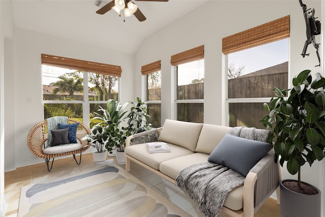 sunroom featuring vaulted ceiling and a ceiling fan