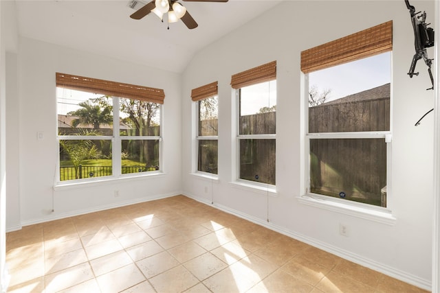 interior space with a healthy amount of sunlight, a ceiling fan, and lofted ceiling