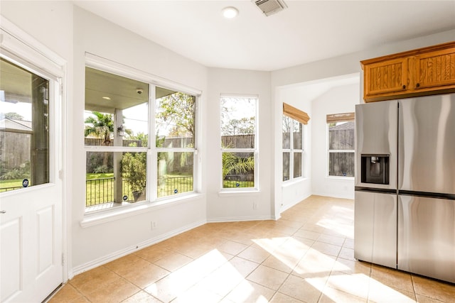 unfurnished sunroom featuring visible vents