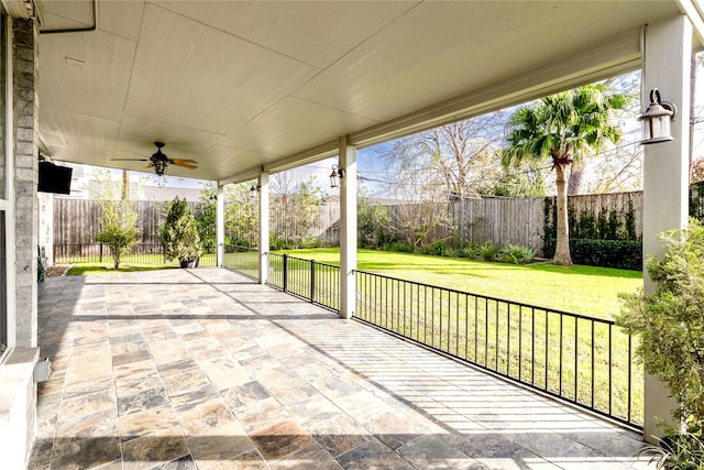 view of patio with a fenced backyard and ceiling fan