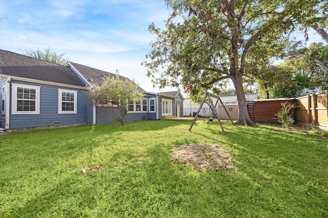 view of yard with a fenced backyard