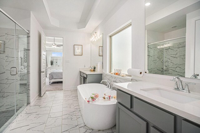 ensuite bathroom featuring a sink, a marble finish shower, a soaking tub, and marble finish floor