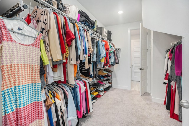 spacious closet with carpet floors