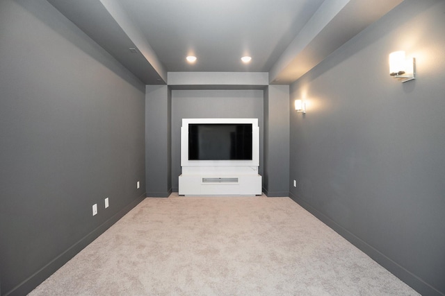 interior space featuring carpet flooring and baseboards