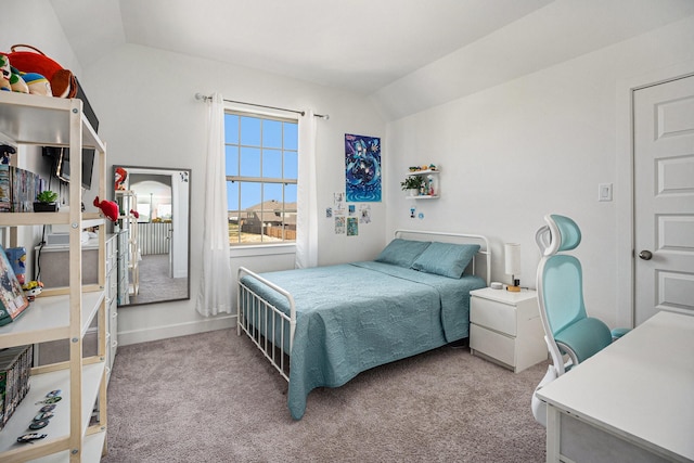 bedroom with carpet and vaulted ceiling