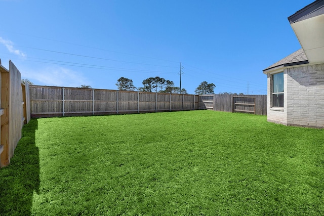 view of yard featuring a fenced backyard