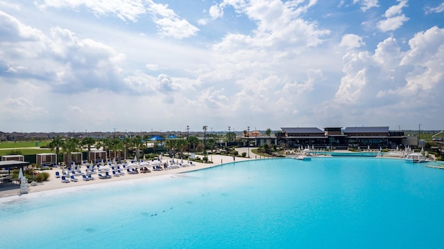 view of swimming pool featuring a water view