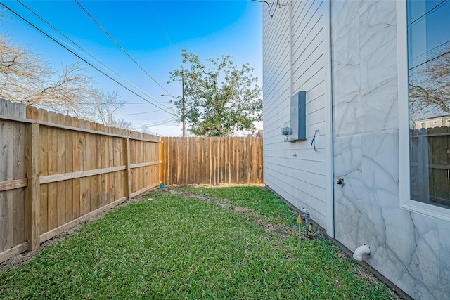 view of yard with a fenced backyard