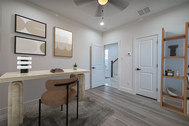 home office with a ceiling fan, wood finished floors, visible vents, baseboards, and recessed lighting