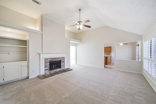 unfurnished living room featuring baseboards, light colored carpet, visible vents, and a fireplace with raised hearth