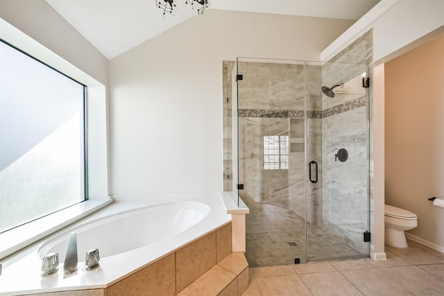 full bathroom with tile patterned floors, a garden tub, toilet, a shower stall, and vaulted ceiling